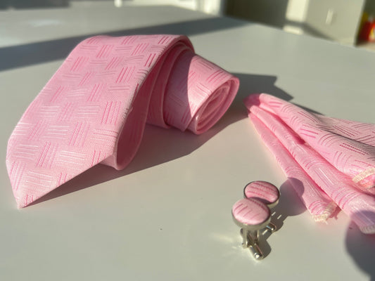 Full display of the pink tie set, showcasing the cohesiveness of the tie, pocket square, and cufflinks